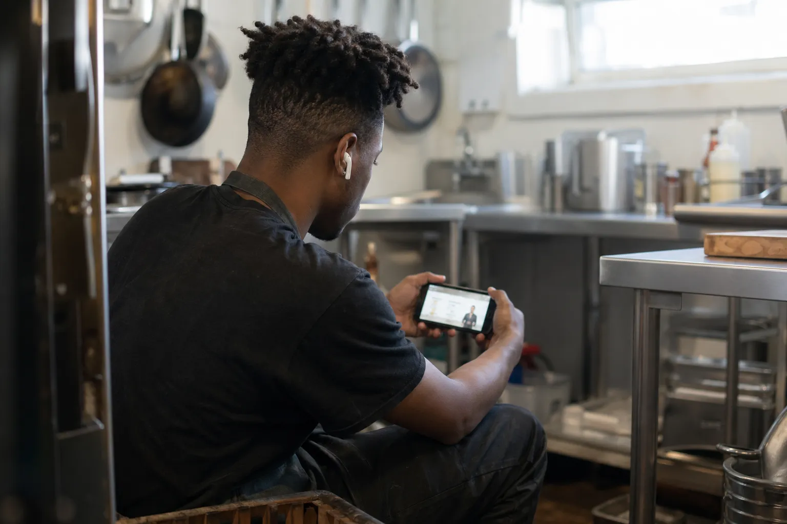 A learner studying a CertReady module on their phone
